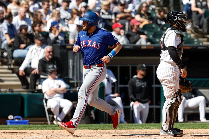 May 25, 2025; Chicago, Illinois, USA; Texas Rangers first baseman Jake Burger (21) scores against the Chicago White Sox during the ninth inning at Rate Field. Mandatory Credit: Kamil Krzaczynski-Imagn Images