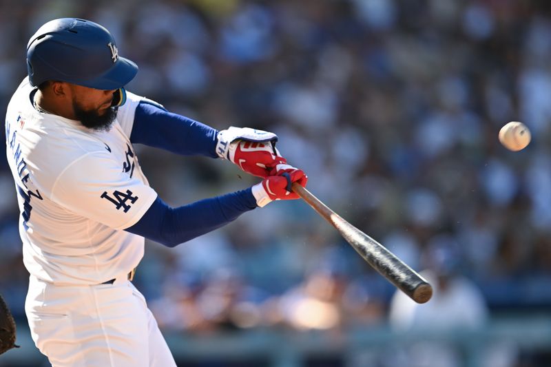Jul 21, 2024; Los Angeles, California, USA; Los Angeles Dodgers outfielder Teoscar Hernández (37) hits a home run against the Boston Red Sox during the third inning at Dodger Stadium. Mandatory Credit: Jonathan Hui-USA TODAY Sports