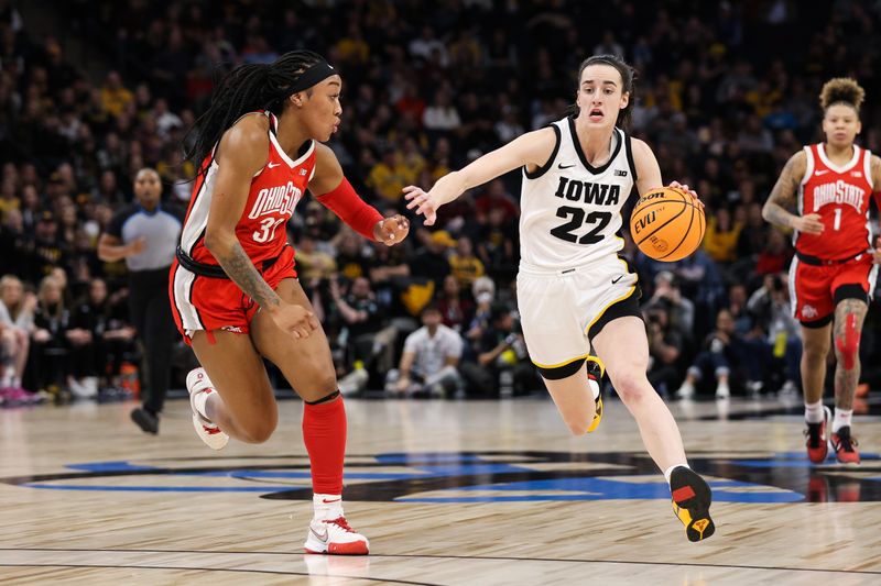 Mar 5, 2023; Minneapolis, MINN, USA; Iowa Hawkeyes guard Caitlin Clark (22) dribbles while Ohio State Buckeyes forward Cotie McMahon (32) defends during the first half at Target Center. Mandatory Credit: Matt Krohn-USA TODAY Sports