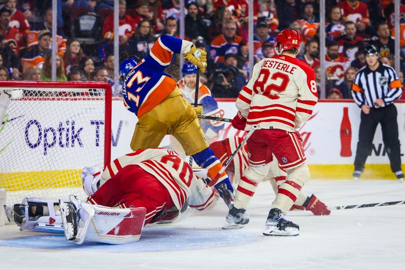 Jan 20, 2024; Calgary, Alberta, CAN; Edmonton Oilers center Mattias Janmark (13) and Calgary Flames goaltender Dan Vladar (80) collides during the third period at Scotiabank Saddledome. Mandatory Credit: Sergei Belski-USA TODAY Sports