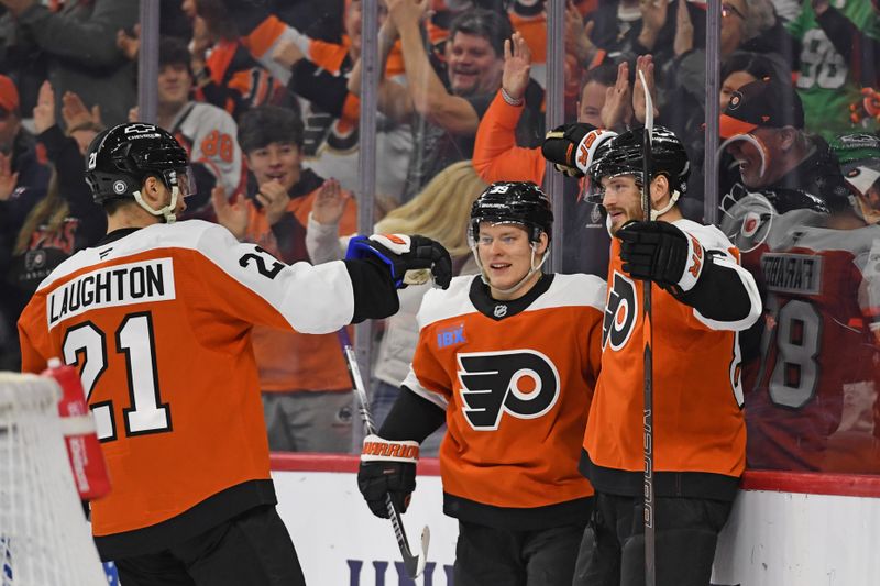 Jan 27, 2025; Philadelphia, Pennsylvania, USA; Philadelphia Flyers left wing Joel Farabee (86) celebrates his goal with center Scott Laughton (21) and right wing Matvei Michkov (39) during the first period at Wells Fargo Center. Mandatory Credit: Eric Hartline-Imagn Images