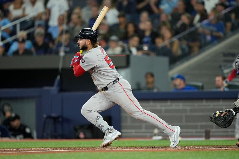 Sep 23, 2024; Toronto, Ontario, CAN; Boston Red Sox right fielder Wilyer Abreu (52) hits a RBI double against the Toronto Blue Jays during the third inning at Rogers Centre. Mandatory Credit: John E. Sokolowski-Imagn Images