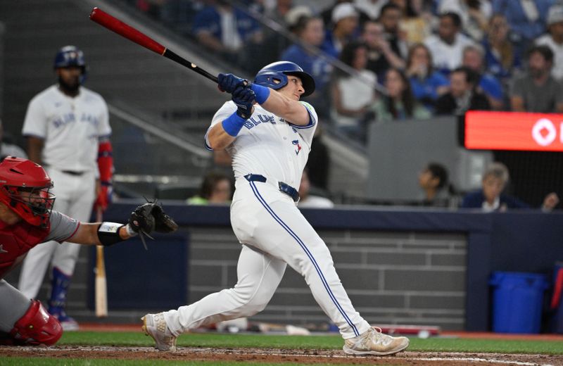 Aug 22, 2024; Toronto, Ontario, CAN;  Toronto Blue Jays center fielder Daulton Varsho (25) hits a double against the Los Angeles Angels in the second inning at Rogers Centre. Mandatory Credit: Dan Hamilton-USA TODAY Sports