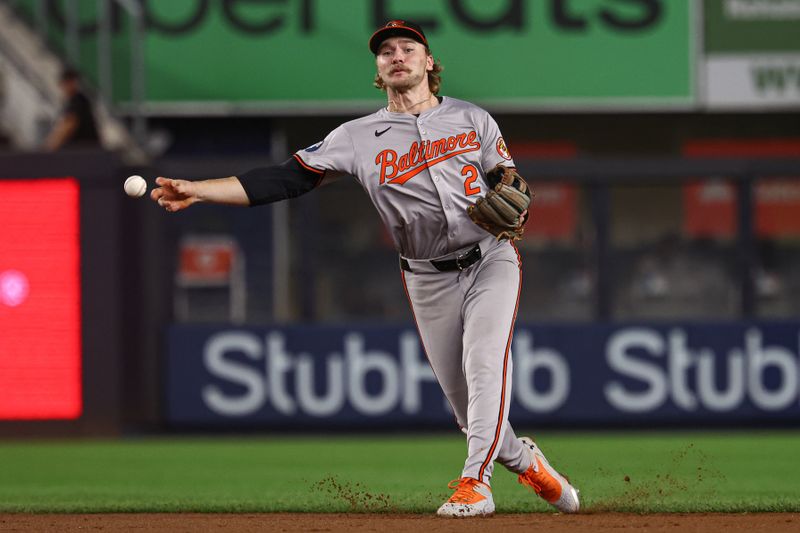 Sep 26, 2024; Bronx, New York, USA; Baltimore Orioles shortstop Gunnar Henderson (2) makes an errant throw to first base during the seventh inning on a ball hit by New York Yankees second baseman Gleyber Torres (not pictured) at Yankee Stadium. Mandatory Credit: Vincent Carchietta-Imagn Images