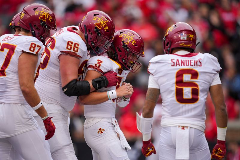 Oct 14, 2023; Cincinnati, Ohio, USA;  Iowa State Cyclones quarterback Rocco Becht (3) celebrates with teammates after scoring a touchdown against the Cincinnati Bearcats in the first half at Nippert Stadium. Mandatory Credit: Aaron Doster-USA TODAY Sports