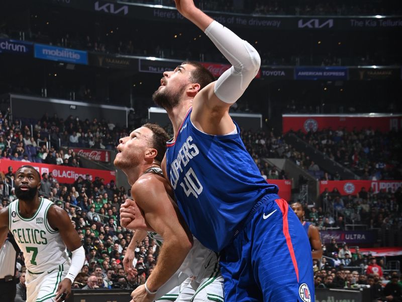 LOS ANGELES, CA - DECEMBER 12: Blake Griffin #91 of the Boston Celtics plays defense on Ivica Zubac #40 of the LA Clippers during the game on December 12, 2022 at Crypto.Com Arena in Los Angeles, California. NOTE TO USER: User expressly acknowledges and agrees that, by downloading and/or using this Photograph, user is consenting to the terms and conditions of the Getty Images License Agreement. Mandatory Copyright Notice: Copyright 2022 NBAE (Photo by Andrew D. Bernstein/NBAE via Getty Images)