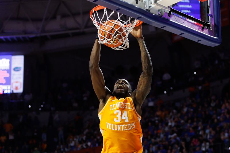 Jan 7, 2025; Gainesville, Florida, USA; Tennessee Volunteers forward Felix Okpara (34) dunks the ball against the Florida Gators during the first half at Exactech Arena at the Stephen C. O'Connell Center. Mandatory Credit: Matt Pendleton-Imagn Images