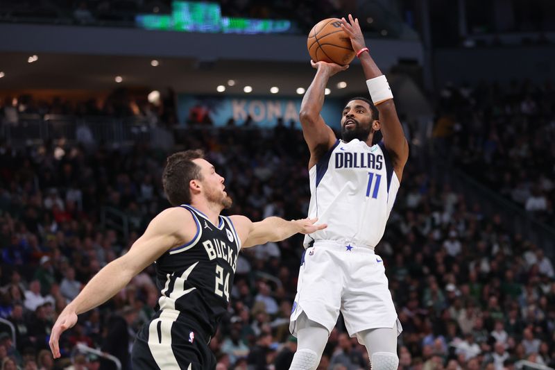 MILWAUKEE, WISCONSIN - NOVEMBER 18: Kyrie Irving #11 of the Dallas Mavericks shoots over Pat Connaughton #24 of the Milwaukee Bucks during the second half of a game at Fiserv Forum on November 18, 2023 in Milwaukee, Wisconsin. NOTE TO USER: User expressly acknowledges and agrees that, by downloading and or using this photograph, User is consenting to the terms and conditions of the Getty Images License Agreement. (Photo by Stacy Revere/Getty Images)
