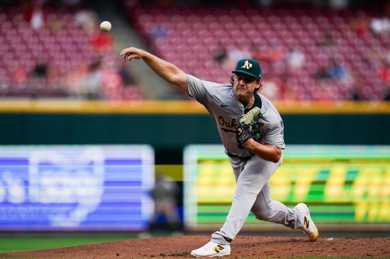 Aug 29, 2024; Cincinnati, Ohio, USA;  Oakland Athletics pitcher J.T. Ginn (70) throws the ball during the first inning of the MLB game between the Cincinnati Reds and Oakland Athletics, Thursday, Aug. 29, 2024, at Cintas Center in Cincinnati. Mandatory Credit: Frank Bowen IV/The Cincinnati Enquirer-USA TODAY Sports