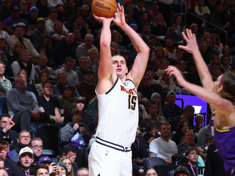 SALT LAKE CITY, UT - JANUARY 10: Nikola Jokic #15 of the Denver Nuggets three point basket during the game against the Utah Jazz on January 10, 2024 at Delta Center in Salt Lake City, Utah. NOTE TO USER: User expressly acknowledges and agrees that, by downloading and or using this Photograph, User is consenting to the terms and conditions of the Getty Images License Agreement. Mandatory Copyright Notice: Copyright 2024 NBAE (Photo by Melissa Majchrzak/NBAE via Getty Images)