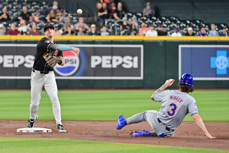 Aug 29, 2024; Phoenix, Arizona, USA;  Arizona Diamondbacks shortstop Kevin Newman (18) turns a double play on New York Mets outfielder Jesse Winker (3) in the second inning at Chase Field. Mandatory Credit: Matt Kartozian-USA TODAY Sports
