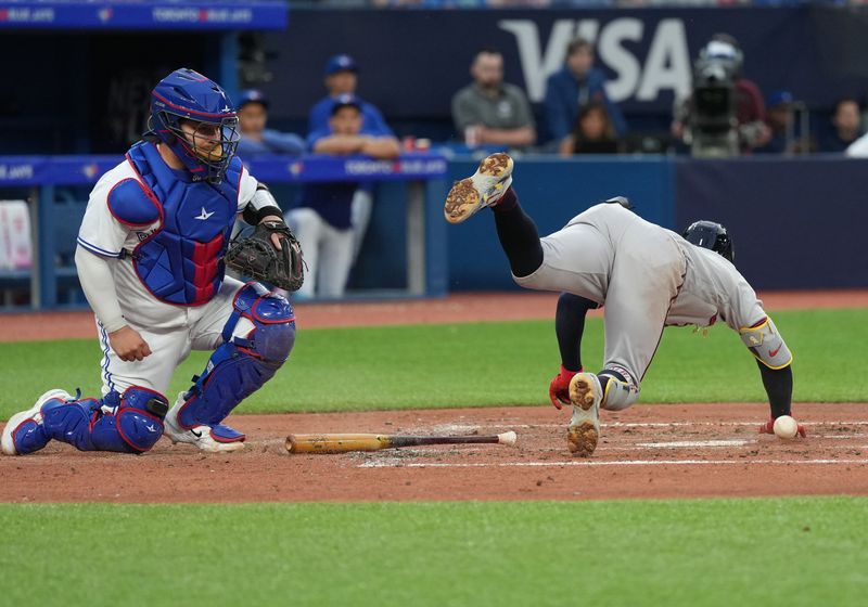 May 12, 2023; Toronto, Ontario, CAN; Atlanta Braves second baseman Ozzie Albies (1) gets hit with a pitch against the Toronto Blue Jays during the fifth inning at Rogers Centre. Mandatory Credit: Nick Turchiaro-USA TODAY Sports