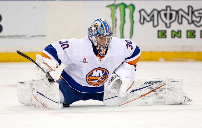 Nov 3, 2024; New York, New York, USA; New York Islanders goalie Ilya Sorokin (30) stretches during a break against the New York Rangers during the first period at Madison Square Garden. Mandatory Credit: Danny Wild-Imagn Images