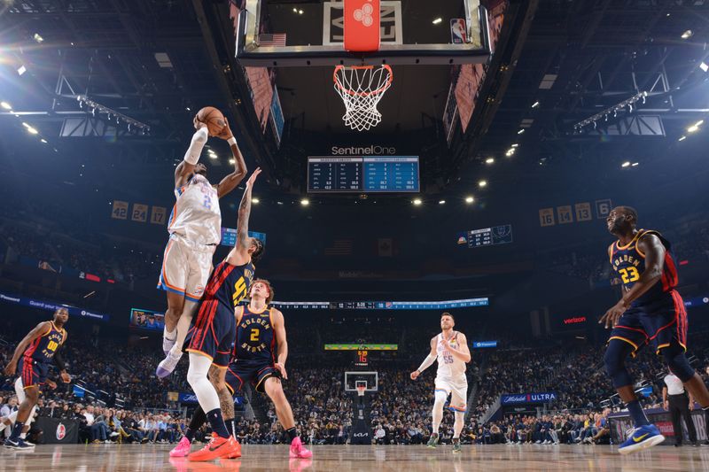 SAN FRANCISCO, CA - NOVEMBER 27: Shai Gilgeous-Alexander #2 of the Oklahoma City Thunder drives to the basket during the game against the Golden State Warriors on November 27, 2024 at Chase Center in San Francisco, California. NOTE TO USER: User expressly acknowledges and agrees that, by downloading and or using this photograph, user is consenting to the terms and conditions of Getty Images License Agreement. Mandatory Copyright Notice: Copyright 2024 NBAE (Photo by Noah Graham/NBAE via Getty Images)