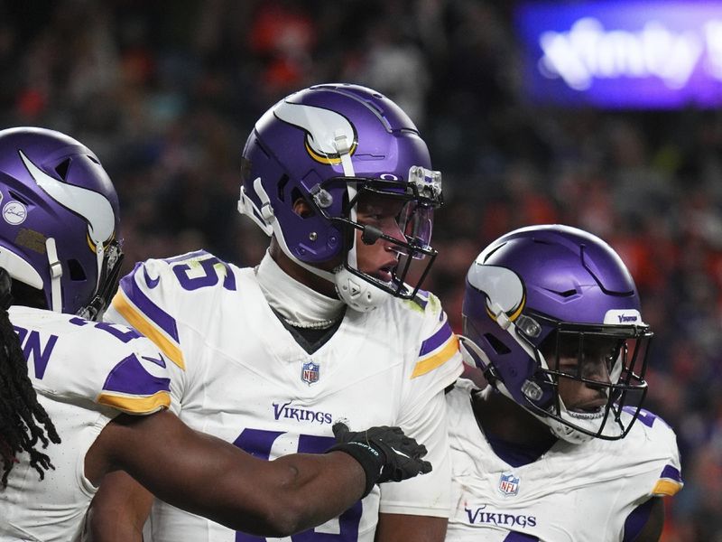 Minnesota Vikings quarterback Joshua Dobbs (15) Lucky Jackson (15) against the Denver Broncos of an NFL football game Sunday November 19, 2023, in Denver. (AP Photo/Bart Young)