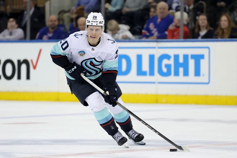 Jan 16, 2024; New York, New York, USA; Seattle Kraken right wing Eeli Tolvanen (20) brings the puck up ice against the New York Rangers during the second period at Madison Square Garden. Mandatory Credit: Brad Penner-USA TODAY Sports