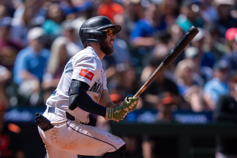 Jun 5, 2025; Seattle, Washington, USA;  Seattle Mariners third baseman Miles Mastrobuoni (21) hits a single during the ninth inning against the Baltimore Orioles at T-Mobile Park. Mandatory Credit: Stephen Brashear-Imagn Images