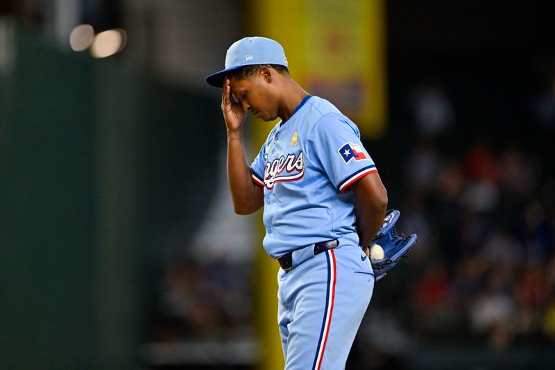 Sep 1, 2024; Arlington, Texas, USA; Texas Rangers relief pitcher Jose Leclerc (25) wipes his forehead as he pitches against the Oakland Athletics during the ninth inning at Globe Life Field. Mandatory Credit: Jerome Miron-USA TODAY Sports