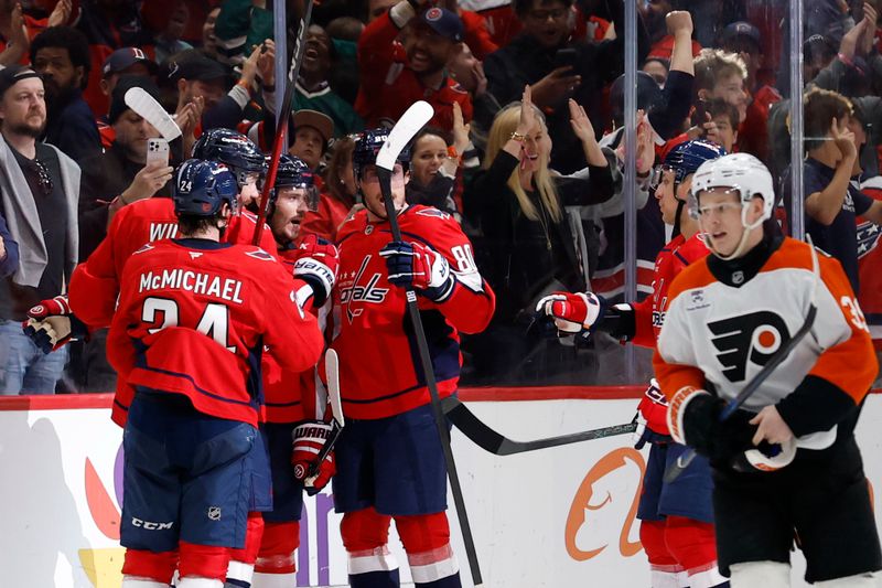 Mar 31, 2026; Washington, District of Columbia, USA; Washington Capitals right wing Tom Wilson (43) celebrates with teammates after scoring an empty-net goal against the Philadelphia Flyers during the third period at Capital One Arena. Mandatory Credit: Geoff Burke-Imagn Images