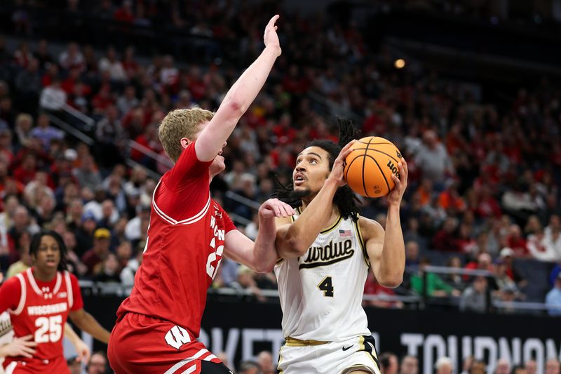 Mar 16, 2024; Minneapolis, MN, USA; Purdue Boilermakers forward Trey Kaufman-Renn (4) shoots as Wisconsin Badgers forward Steven Crowl (22) defends during the first half at Target Center. Mandatory Credit: Matt Krohn-USA TODAY Sports