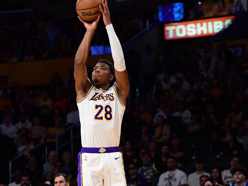 LOS ANGELES, CA - APRIL 27: Rui Hachimura #28 of the Los Angeles Lakers shoots a three point basket against the Denver Nuggets during Round 1 Game 4 of the 2024 NBA Playoffs on April 27, 2024 at Crypto.Com Arena in Los Angeles, California. NOTE TO USER: User expressly acknowledges and agrees that, by downloading and/or using this Photograph, user is consenting to the terms and conditions of the Getty Images License Agreement. Mandatory Copyright Notice: Copyright 2024 NBAE (Photo by Adam Pantozzi/NBAE via Getty Images)