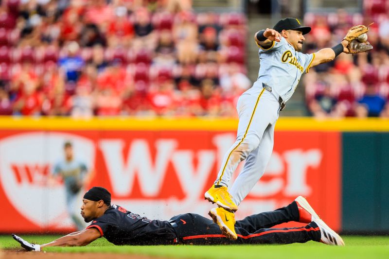 Sep 20, 2024; Cincinnati, Ohio, USA; Cincinnati Reds outfielder Will Benson (30) steals second against Pittsburgh Pirates second baseman Nick Gonzales (39) in the third inning at Great American Ball Park. Mandatory Credit: Katie Stratman-Imagn Images