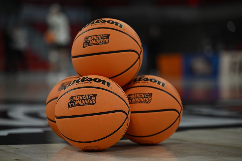 Mar 23, 2024; Raleigh, North Carolina, USA; A general photo showing the NCAA March Madness basketballs and logo prior to the first round game between the Green Bay Phoenix and the Tennessee Lady Vols in the 2024 NCAA Women's Tournament at James T. Valvano Arena at William Neal Reynolds. Mandatory Credit: William Howard-USA TODAY Sports