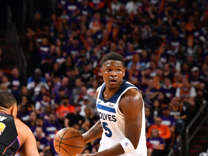 PHOENIX, AZ - APRIL 26:  Anthony Edwards #5 of the Minnesota Timberwolves handles the ball during the game against the Phoenix Suns during Round 1 Game 3 of the 2024 NBA Playoffs on April 26, 2024 at Footprint Center in Phoenix, Arizona. NOTE TO USER: User expressly acknowledges and agrees that, by downloading and or using this photograph, user is consenting to the terms and conditions of the Getty Images License Agreement. Mandatory Copyright Notice: Copyright 2024 NBAE (Photo by Barry Gossage/NBAE via Getty Images)