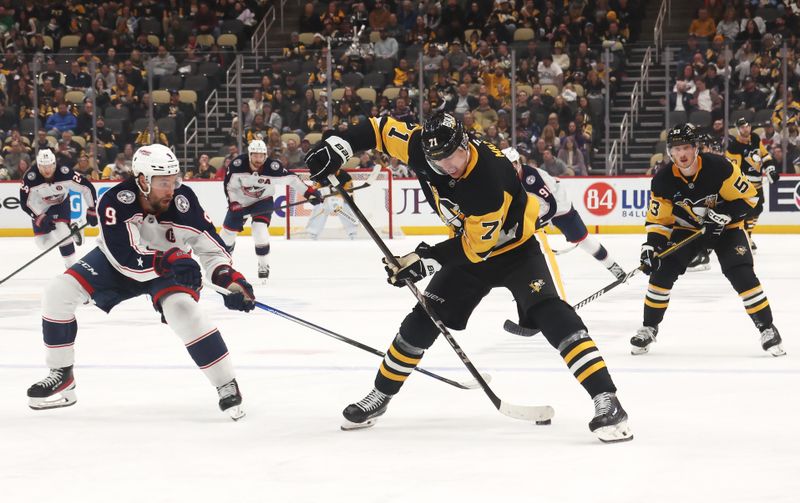 Mar 21, 2025; Pittsburgh, Pennsylvania, USA;  Pittsburgh Penguins center Evgeni Malkin (71) moves the puck against Columbus Blue Jackets defenseman Ivan Provorov (9) during the third period at PPG Paints Arena. Mandatory Credit: Charles LeClaire-Imagn Images
