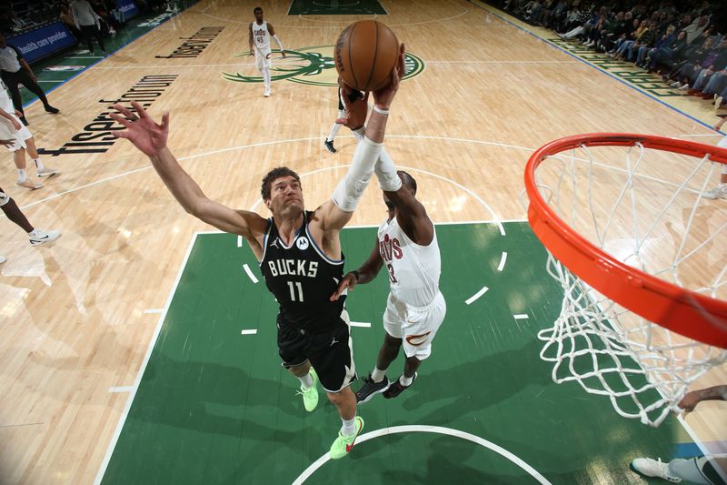 MILWAUKEE, WI - JANUARY 26:  Brook Lopez #11 of the Milwaukee Bucks rebounds the ball during the game  against the Cleveland Cavaliers on January 26, 2024 at the Fiserv Forum Center in Milwaukee, Wisconsin. NOTE TO USER: User expressly acknowledges and agrees that, by downloading and or using this Photograph, user is consenting to the terms and conditions of the Getty Images License Agreement. Mandatory Copyright Notice: Copyright 2024 NBAE (Photo by Gary Dineen/NBAE via Getty Images).