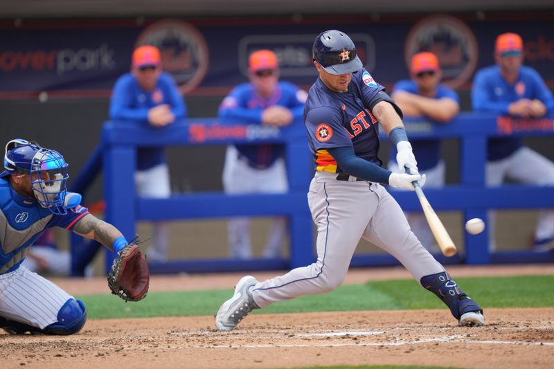 Mar 23, 2024; Port St. Lucie, Florida, USA; Houston Astros third baseman Alex Bregman (2) hits a double in the third inning against the New York Mets at Clover Park. Mandatory Credit: Jim Rassol-USA TODAY Sports