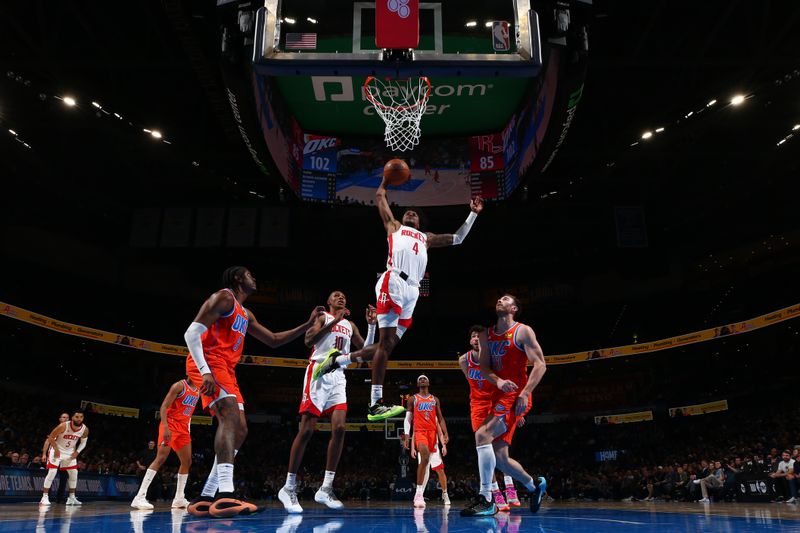 OKLAHOMA CITY, OK - FEBRUARY 27: Jalen Green #4 of the Houston Rockets dunks the ball during the game against the Oklahoma City Thunder on February, 2024 at Paycom Arena in Oklahoma City, Oklahoma. NOTE TO USER: User expressly acknowledges and agrees that, by downloading and or using this photograph, User is consenting to the terms and conditions of the Getty Images License Agreement. Mandatory Copyright Notice: Copyright 2024 NBAE (Photo by Zach Beeker/NBAE via Getty Images)