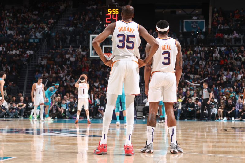 CHARLOTTE, NC - MARCH 15:  Kevin Durant #35 of the Phoenix Suns & Bradley Beal #3 of the Phoenix Suns looks on during the game on March 15, 2024 at Spectrum Center in Charlotte, North Carolina. NOTE TO USER: User expressly acknowledges and agrees that, by downloading and or using this photograph, User is consenting to the terms and conditions of the Getty Images License Agreement.  Mandatory Copyright Notice:  Copyright 2024 NBAE (Photo by Nathaniel S. Butler/NBAE via Getty Images)