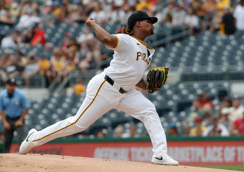 Aug 25, 2024; Pittsburgh, Pennsylvania, USA;  Pittsburgh Pirates starting pitcher Luis L. Ortiz (48) delivers a pitch against the Cincinnati Reds during the first inning at PNC Park. Mandatory Credit: Charles LeClaire-USA TODAY Sports