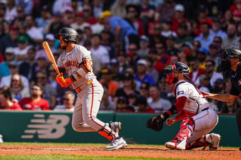 May 2, 2024; Boston, Massachusetts, USA; San Francisco Giants second baseman Thairo Estrada (39) gets a hit to drive in a run against the Boston Red Sox in the seventh inning at Fenway Park. Mandatory Credit: David Butler II-USA TODAY Sports
