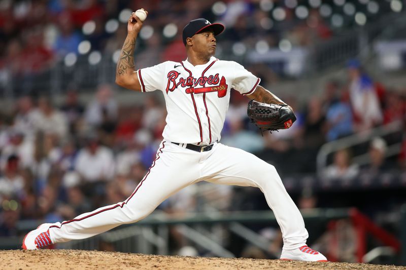 Sep 7, 2023; Atlanta, Georgia, USA; Atlanta Braves relief pitcher Raisel Iglesias (26) throws against the St. Louis Cardinals in the ninth inning at Truist Park. Mandatory Credit: Brett Davis-USA TODAY Sports
