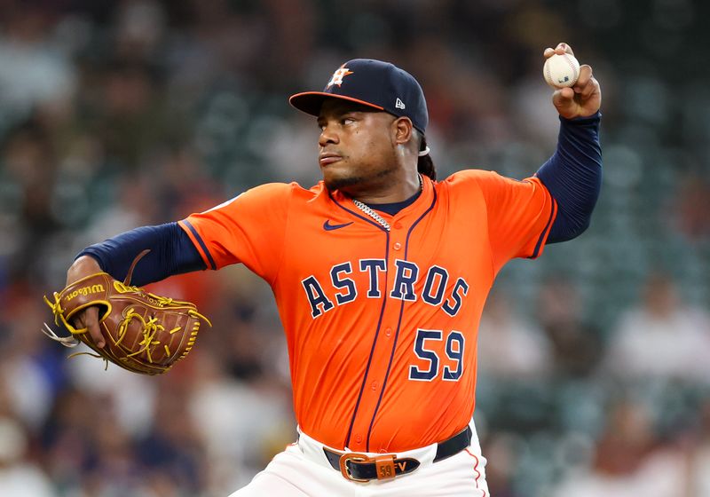 May 13, 2025; Houston, Texas, USA; Houston Astros starting pitcher Framber Valdez (59) pitches against the Kansas City Royals in the first inning at Daikin Park. Mandatory Credit: Thomas Shea-Imagn Images