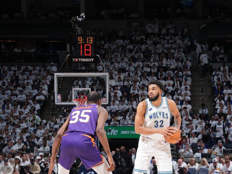 MINNEAPOLIS, MN -  APRIL 20: Karl-Anthony Towns #32 of the Minnesota Timberwolves handles the ball during Round One Game One of the 2024 NBA Playoffs against the Phoenix Suns on April 20, 2024 at Target Center in Minneapolis, Minnesota. NOTE TO USER: User expressly acknowledges and agrees that, by downloading and or using this Photograph, user is consenting to the terms and conditions of the Getty Images License Agreement. Mandatory Copyright Notice: Copyright 2024 NBAE (Photo by Jordan Johnson/NBAE via Getty Images)