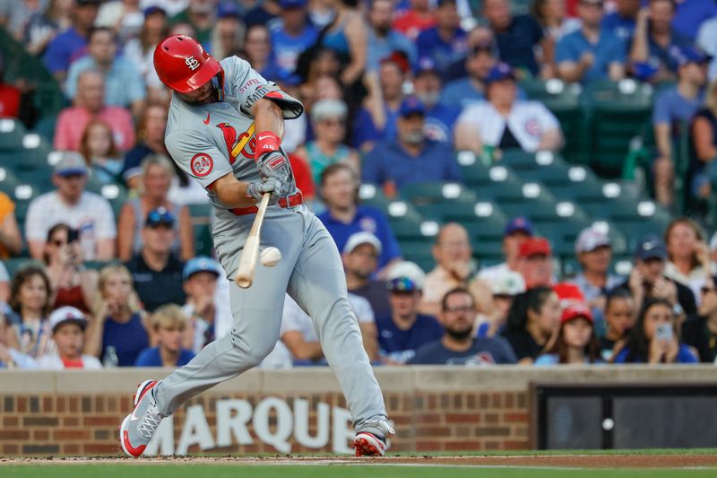 Aug 1, 2024; Chicago, Illinois, USA; St. Louis Cardinals first baseman Paul Goldschmidt (46) hits a solo home run against the Chicago Cubs during the first inning at Wrigley Field. Mandatory Credit: Kamil Krzaczynski-USA TODAY Sports