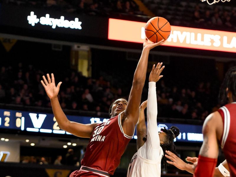 Jan 15, 2025; Nashville, Tennessee, USA;  Vanderbilt Commodores guard Chris Manon (30) lays the ball in against the Vanderbilt Commodores during the first half at Memorial Gymnasium. Mandatory Credit: Steve Roberts-Imagn Images