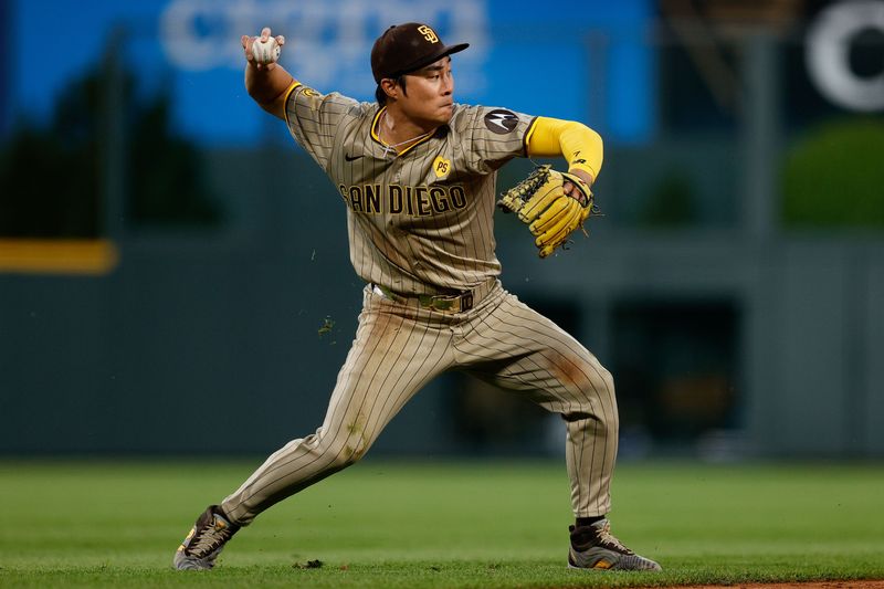 Apr 24, 2024; Denver, Colorado, USA; San Diego Padres shortstop Ha-Seong Kim (7) fields and throws to first in the fourth inning against the Colorado Rockies at Coors Field. Mandatory Credit: Isaiah J. Downing-USA TODAY Sports