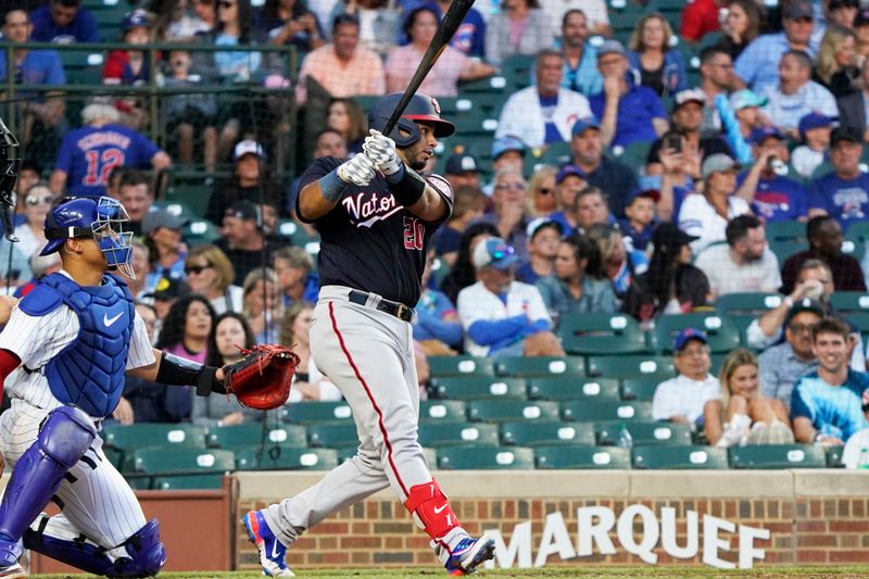 Jul 18, 2023; Chicago, Illinois, USA; Washington Nationals catcher Keibert Ruiz (20) hits a single against the Chicago Cubs during the fourth inning at Wrigley Field. Mandatory Credit: David Banks-USA TODAY Sports