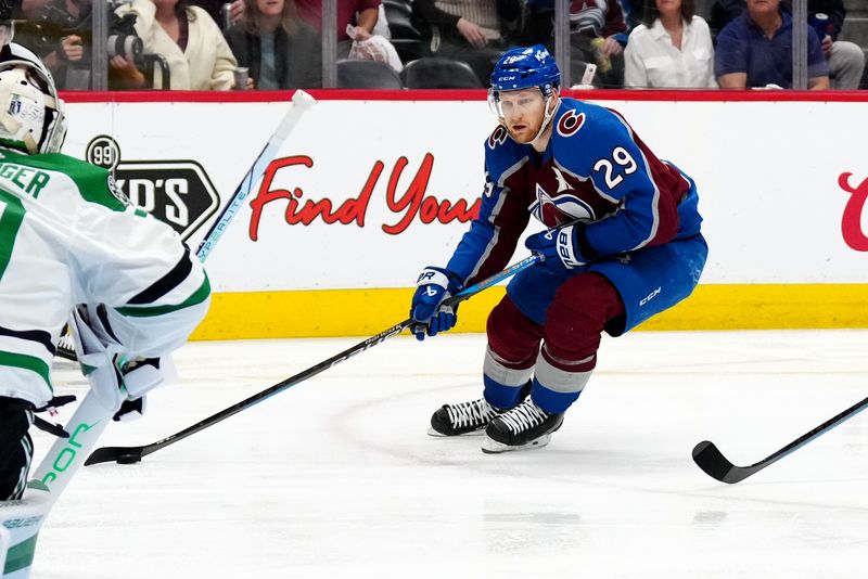 May 17, 2024; Denver, Colorado, USA; Colorado Avalanche center Nathan MacKinnon (29) skates towards Dallas Stars goaltender Jake Oettinger (29) in the second period in game six of the second round of the 2024 Stanley Cup Playoffs at Ball Arena. Mandatory Credit: Ron Chenoy-USA TODAY Sports