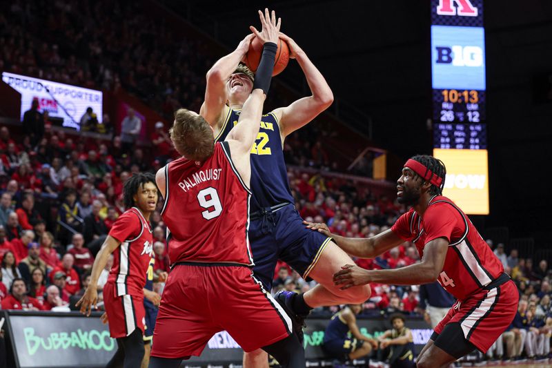 Feb 29, 2024; Piscataway, New Jersey, USA; Michigan Wolverines forward Will Tschetter (42) is fouled by Rutgers Scarlet Knights forward Oskar Palmquist (9) in front of guard Austin Williams (24) during the first half at Jersey Mike's Arena. Mandatory Credit: Vincent Carchietta-USA TODAY Sports