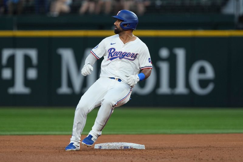 Sep 7, 2024; Arlington, Texas, USA; Texas Rangers left fielder Ezequiel Duran (20) stops and looks at second base on his two-run double against the Los Angeles Angels during the fifth inning at Globe Life Field. Mandatory Credit: Jim Cowsert-Imagn Images