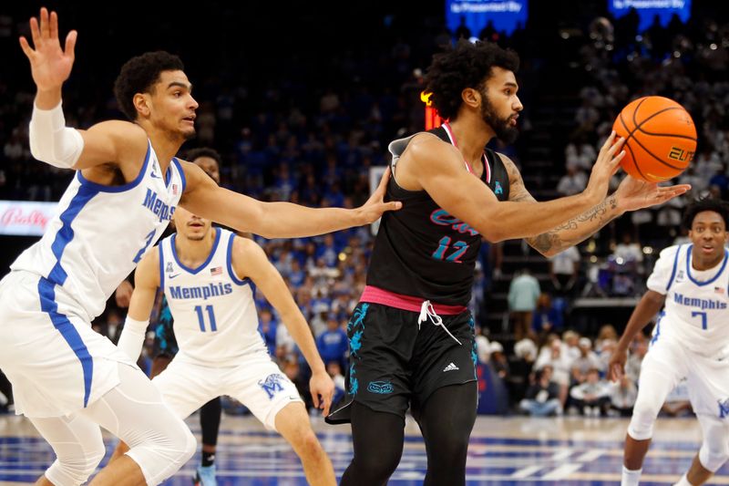 Feb 25, 2024; Memphis, Tennessee, USA; Florida Atlantic Owls guard Jalen Gaffney (12) passes the ball as Memphis Tigers forward Nicholas Jourdain (2) defends during the second half at FedExForum. Mandatory Credit: Petre Thomas-USA TODAY Sports