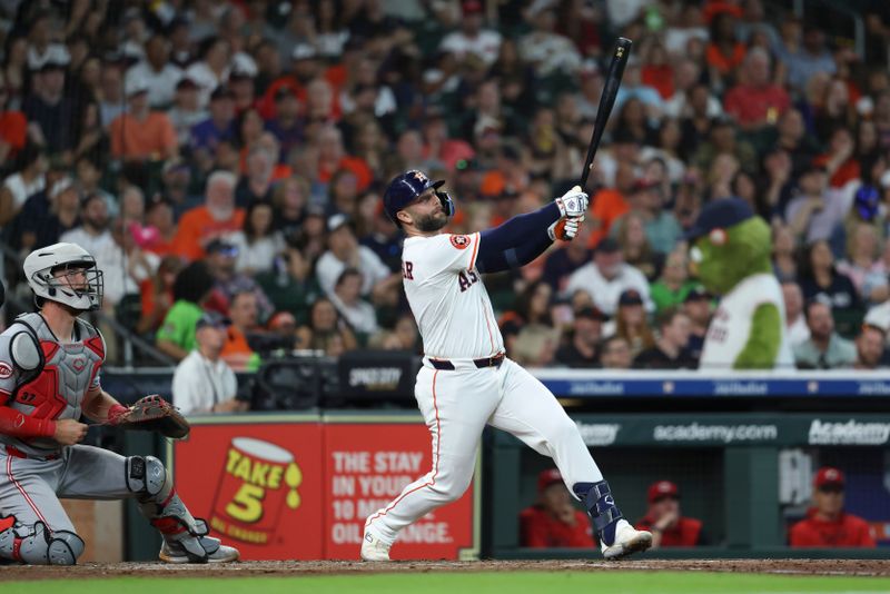 May 10, 2025; Houston, Texas, USA; Houston Astros first baseman Christian Walker (8) hits a triple during the third inning against the Cincinnati Reds at Daikin Park. Mandatory Credit: Troy Taormina-Imagn Images