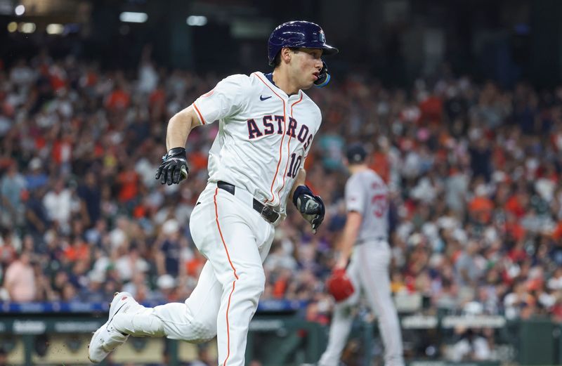 Aug 20, 2024; Houston, Texas, USA; Houston Astros third baseman Shay Whitcomb (10) runs to first base on a double during the second inning av/ at Minute Maid Park. Mandatory Credit: Troy Taormina-USA TODAY Sports