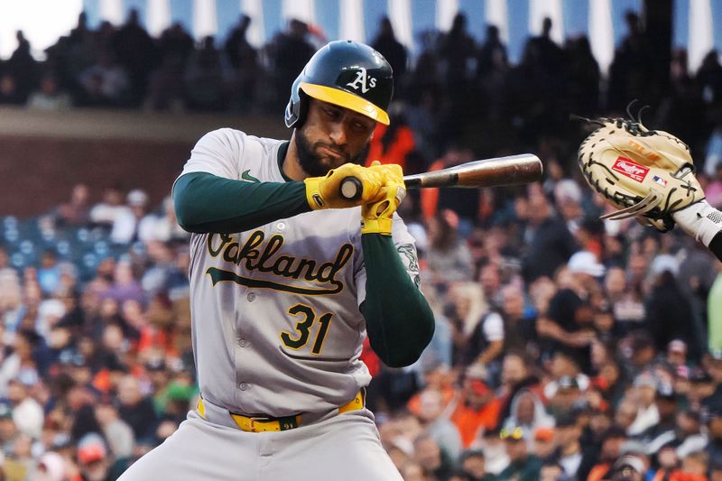 Jul 31, 2024; San Francisco, California, USA; Oakland Athletics third baseman Abraham Toro (31) avoids the high pitch before earning a walk against the San Francisco Giants during the fourth inning at Oracle Park. Mandatory Credit: Kelley L Cox-USA TODAY Sports