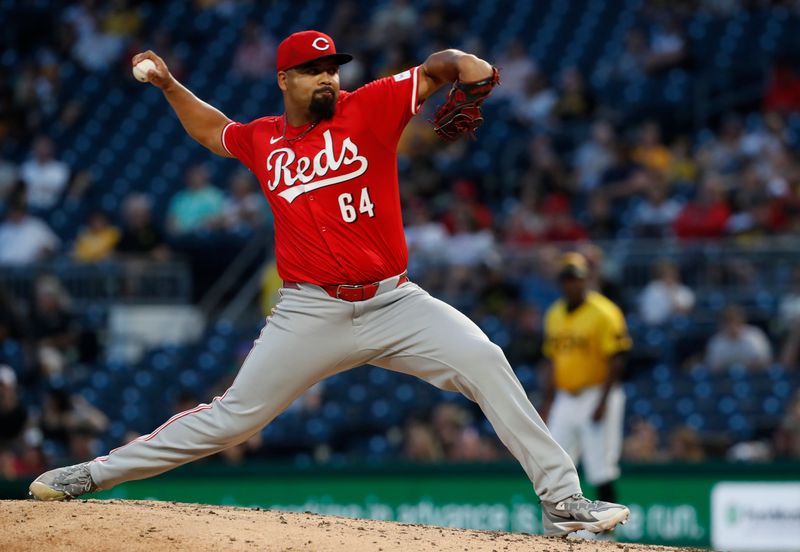 Aug 23, 2024; Pittsburgh, Pennsylvania, USA;  Cincinnati Reds relief pitcher Tony Santillan (64) pitches against the Pittsburgh Pirates during the fourth inning at PNC Park. Mandatory Credit: Charles LeClaire-USA TODAY Sports